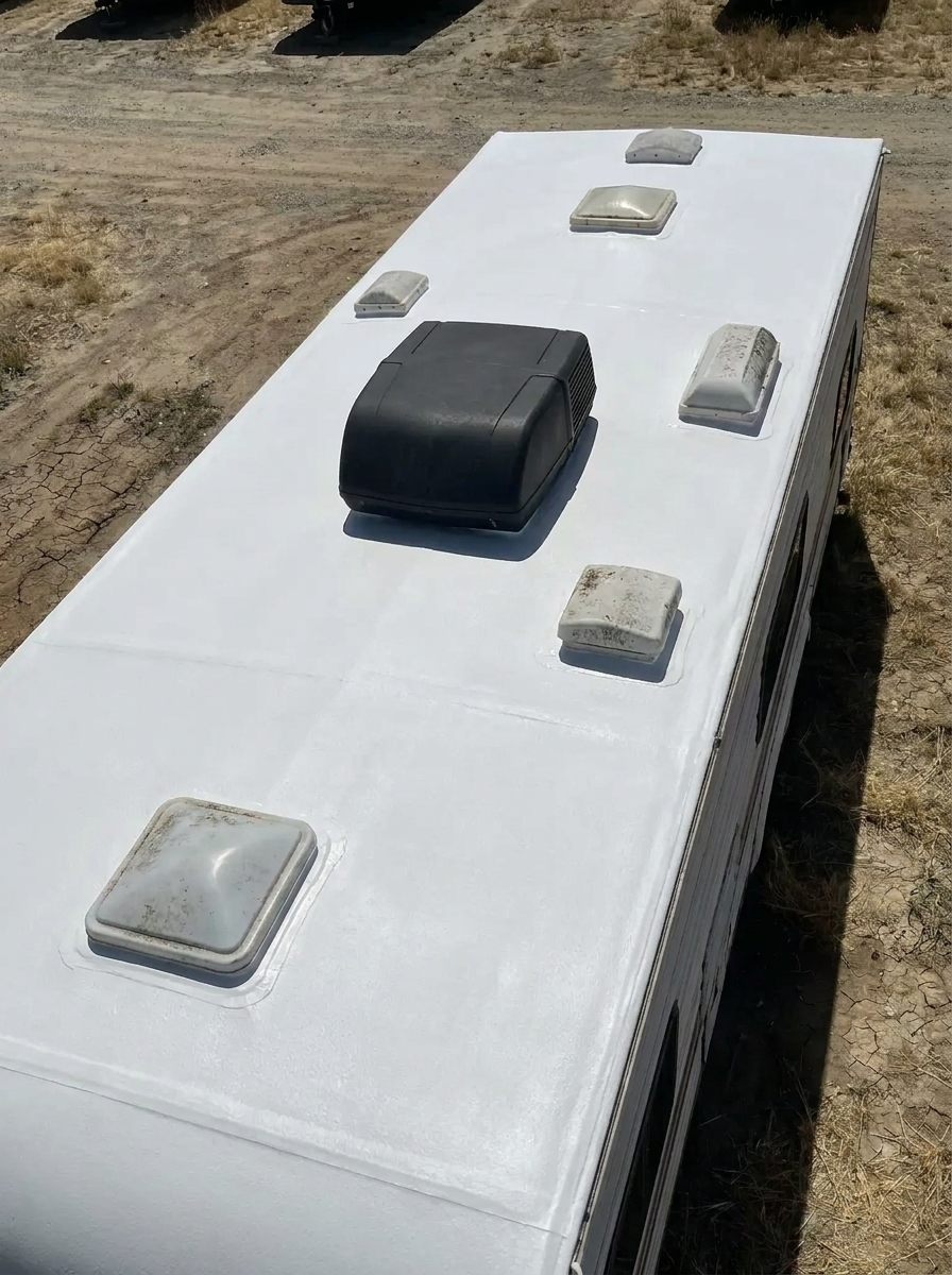 After: commercial-grade silicone coating sealing the full RV roof